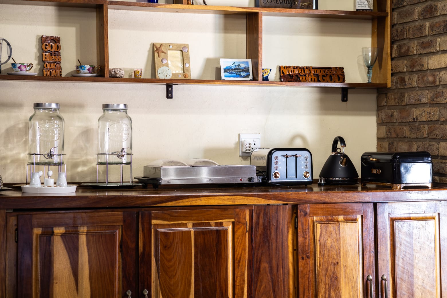 Detailed view of the breakfast station and kitchen amenities including a toaster, kettle, and fresh water dispensers.